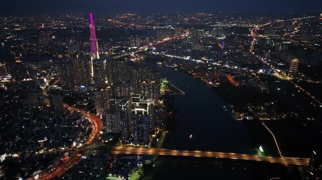Aerial Night View of Saigon Skyline and Landmark 81 by the River