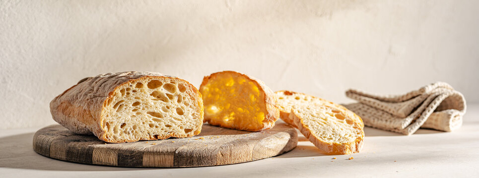 Artisan Sourdough Bread Slices on Wooden Board