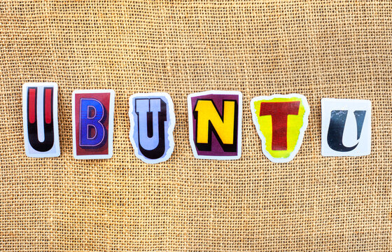 Ubuntu word made from colorful cut out letters on rustic hessian background