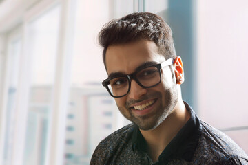 Fototapeta premium Close up portrait of man smiling,wearing eyeglasses