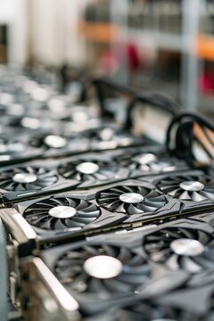 Rows of powerful computer graphics processing units with fans, designed for cryptocurrency mining and high-performance computing