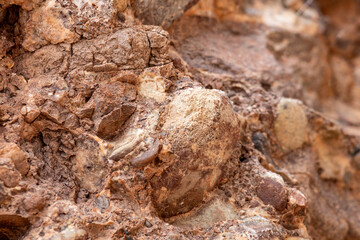 Obraz premium Gaspesie, Quebec, 07 June 2026 : Close-up view of a natural rock formation showing embedded stones and textured surfaces