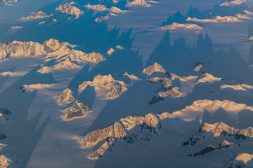 Serrated Greenland peaks and glacier shadows © Thomas