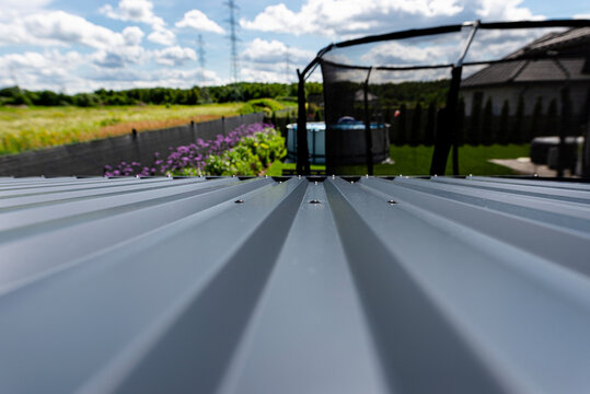 Corrugated metal roof structure on a modern simple house
