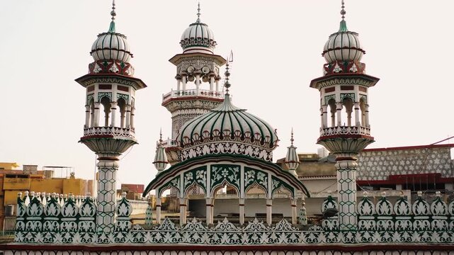 Symmetrical View of Mosque Minarets and Dome Against Clear Sky