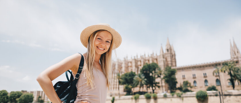 Young Female Tourist with Backpack and Smartphone Enjoying Panoramic View of Rome