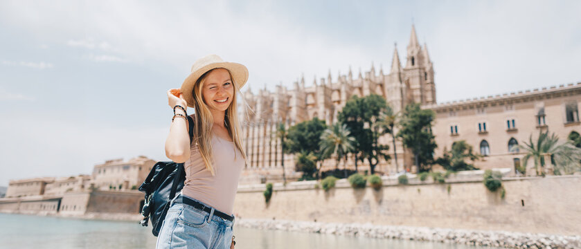 Young Female Tourist with Backpack and Smartphone Enjoying Panoramic View of Rome