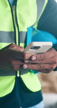 Phone, architect and hands of man on construction site for project, renovation or text message. Engineer, building inspection and property developer with person for communication and contractor