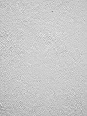 Vertical off white roughcast plaster wall texture with fine irregular surface © rumata79