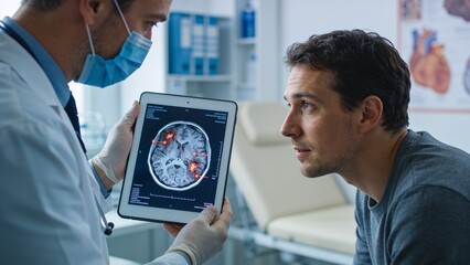 Obraz premium Masked physician explaining brain imaging results on digital tablet in contemporary neurological clinic examination room.