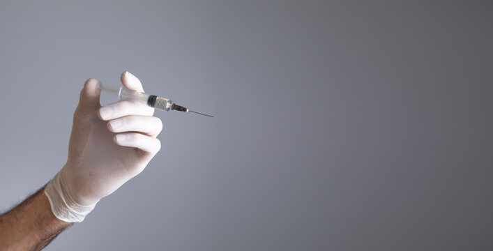 Doctor hand holding a syringe. Injection