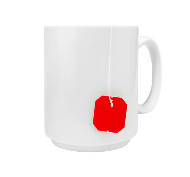 Blank white ceramic mug mockup with tea bag string and blank tag isolated on white background
