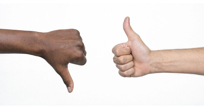 Hands with thumb up and thumb down isolated on white background. Two hands showing thumbs up and thumbs down on white background symbolizing approval and disapproval.