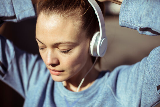 Young woman listening to music outdoors