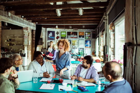 Coworkers brainstorming in a creative loft office