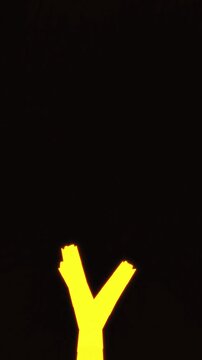 Luminous yellow energy flows vertically up a stylized tree fork in a 3D motion loop crafted for vibrant mobile screensavers