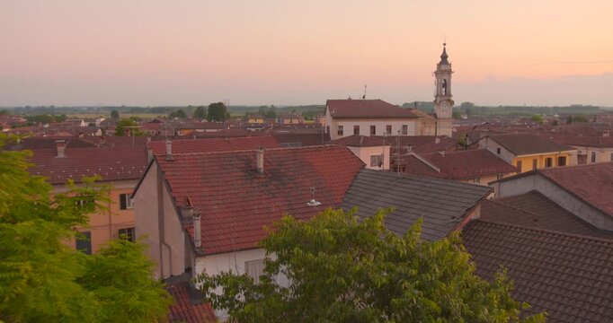 View across the rooftops of Sommariva del Bosco in Piedmont, Italy, featuring traditional buildings and the historic townscape