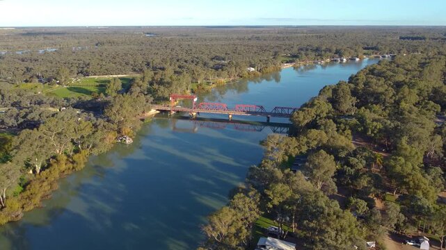 Murray River Drone Vision, houseboats and a bridge on calm water, captured with a drone aerial shot. This scenic landscape highlights outdoor adventure, relaxation and travel