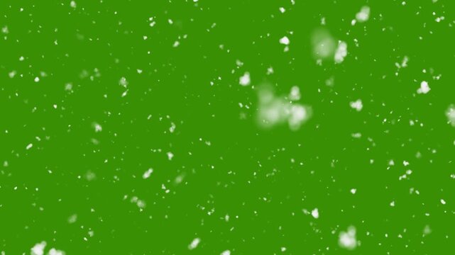 Seasonal falling snow flying on green screen background