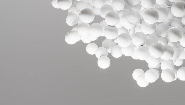 Cluster of smooth white spheres floating against a light gray