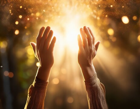 hands lifted towards golden light with particles softly glowing creating an atmosphere of hope and spiritual connection