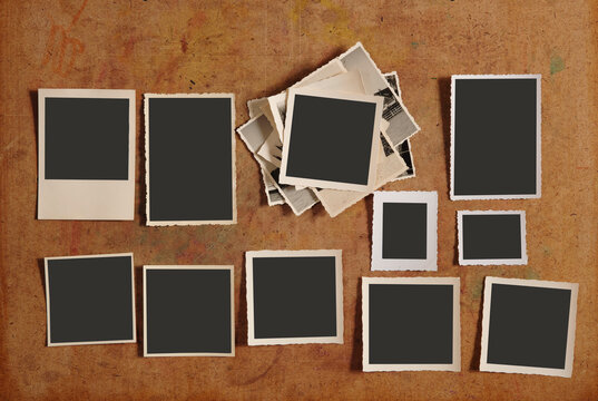 old empty photo frames, vintage blank photographic prints on wood with free space for pictures