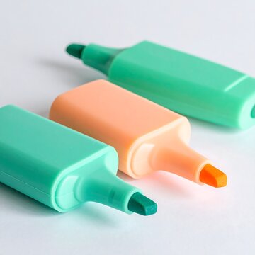 Three pastel colored chunky highlighters on white background.