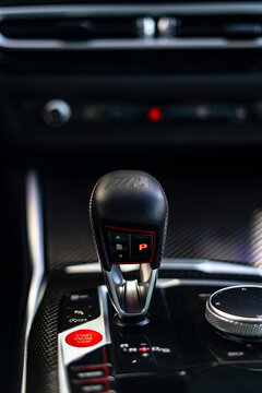 BMW M3 Competition gear selector and center console close up, High performance sports sedan interior detail