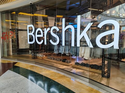 Rome, Italy - November 2, 2025, detail of the Bershka sign, a low-cost clothing brand of the Inditex group, inside a shopping mall.