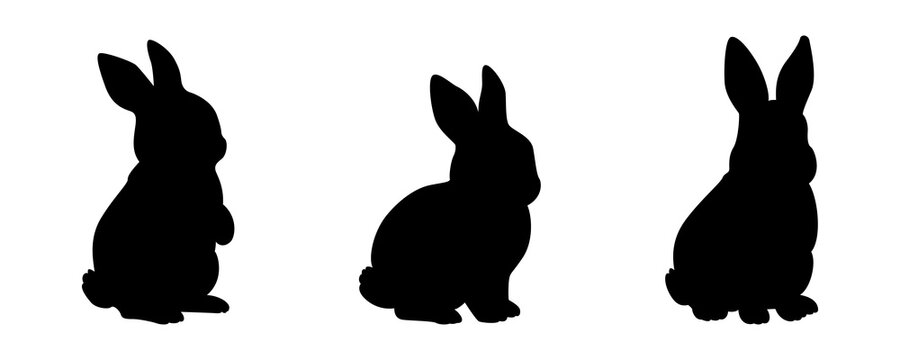 Three black silhouettes of cute rabbits sitting in various poses isolated on transparent background for creative vector design.