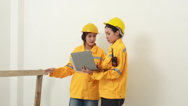 Construction inspectors and engineer discussing project details at an unfinished building site, teamwork, communication, safety compliance, site supervision, safety, construction project management.