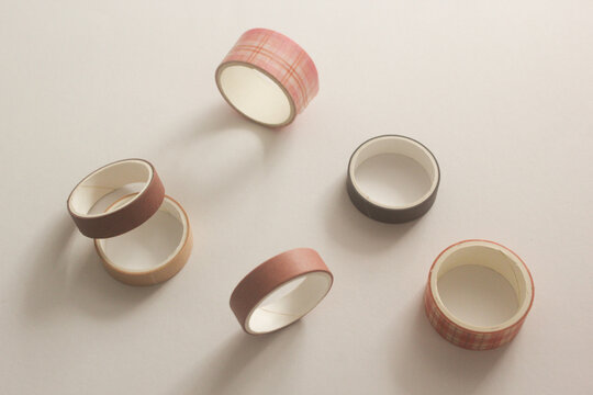 Set of decorative washi tapes on white studio background for DIY crafts, bullet journal, and scrapbooking.