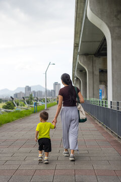 Mother walking with son at outdoor