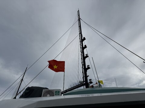Vietnam national flag flying on a boat mast