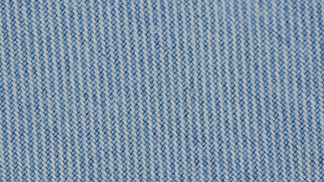 Close up of blue denim fabric with detailed texture and pattern