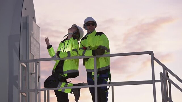 Engineers working on site in wind turbine farm, Wind turbines generate clean energy source, Eco technology for electric, industry environment.