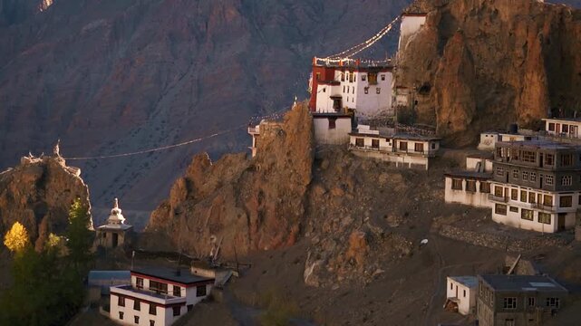 Dramatic landscape of the ancient Dhankar Monastery built on a cliff in the rugged cold desert of Spiti Valley, Himachal Pradesh, India. Tibetan Buddhist monastery in Himalayas. Majestic mountain land