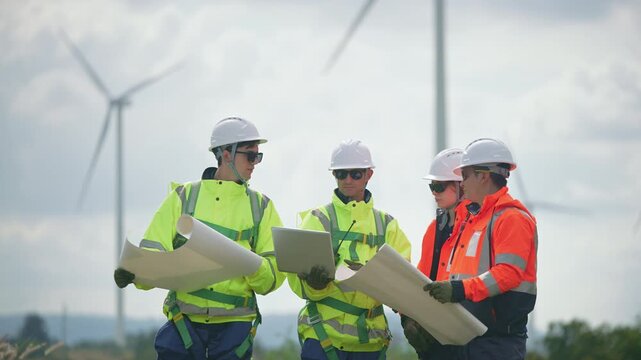 Engineers working on site in wind turbine farm, Wind turbines generate clean energy source, Eco technology for electric, industry environment.