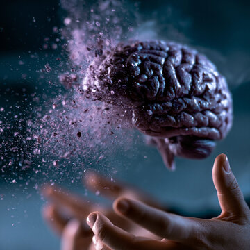 Conceptual human hand holding a digital holographic brain model dissolving