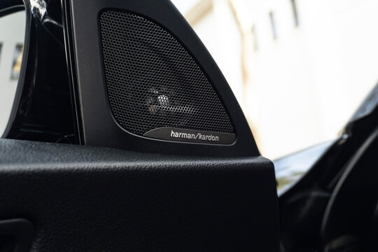 BMW M240i Harman Kardon door speaker grille close up, Luxury sports car interior premium audio system