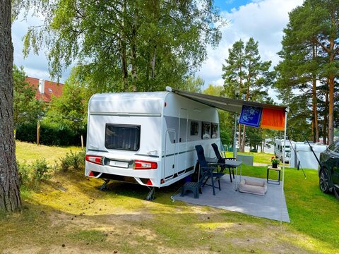 Motorhome campsite by Lake Lipno in Lipno nad Vltavou, Czech Republic on a sunny summer day.