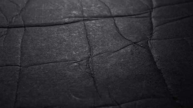 Crinkled Black Paper Texture and Folded Background Loop