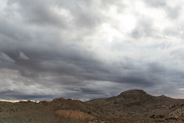 Clouds drift above the desert landscape at Arches National Park, Utah © LB Photo Co