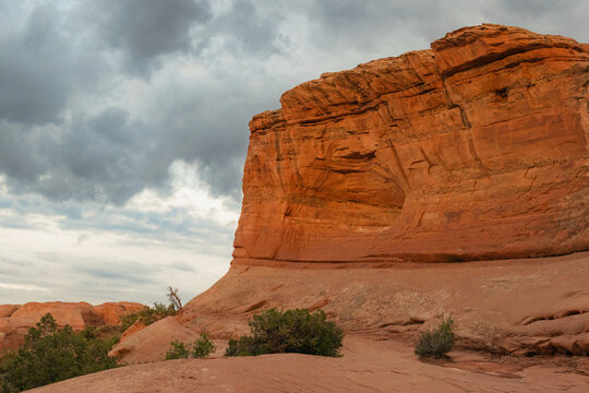 Large rock formations shaped by wind and erosion at sunset in Arches National Park, Utah