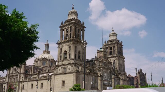 Historic facade of the metropolitan cathedral in the zocalo square, mexico city, with a blue sky