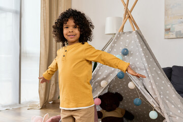 Joyful moments of a young boy exploring his playful home environment © LIGHTFIELD STUDIOS