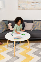 Joyful moments of a young boy exploring creativity at home © LIGHTFIELD STUDIOS