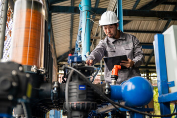 Fototapeta premium Engineer Inspecting Chemical Dosing Pump System During Water Treatment Plant Maintenance Operations