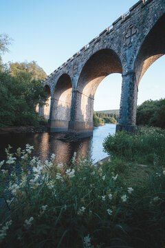 Bake Thin Viaduct spanning Bakethin Reservoir in Northumberland, captured with clear views of the stone arches and calm reflective water