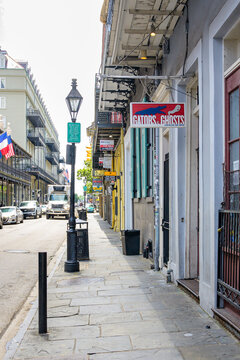 New Orleans, LA, USA - May 30, 2026: Gators and Ghosts, a New Orleans Tour Company, with Cityscape of St. Louis Street in the French Quarter